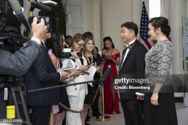 Representative Ted Lieu, a Democrat from California, center, and Betty Lieu arrive to attend a state dinner in honor of South Korean President Yoon...