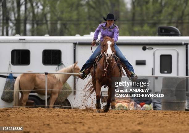 Morissa Hall rides her horse during a local competition, part of the National Barrel Horse Association, at Triple Creek Farm in Lothian, Maryland on...