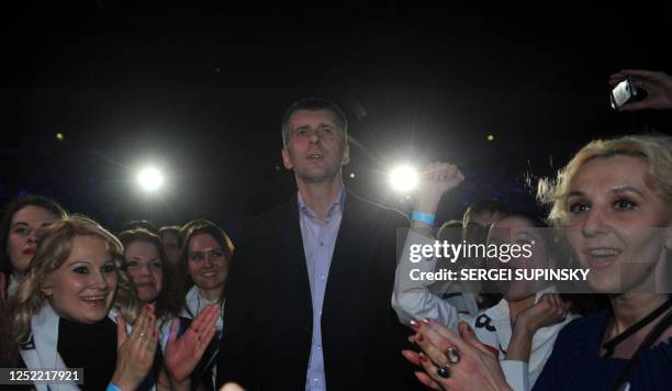 Russian presidential candidate Mikhail Prokhorov is surrounded by supporters during a campaigning rally in Moscow on March 2, 2012. Russia on March 4...