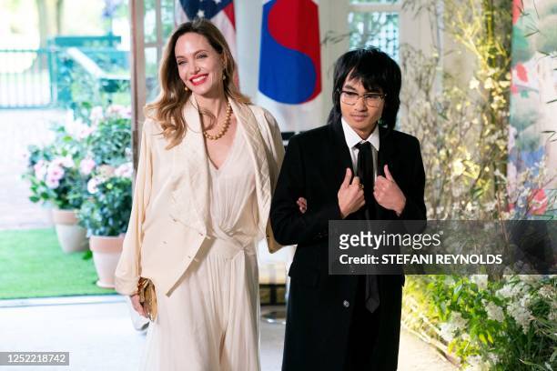 Actress Angelina Jolie and son Maddox arrive for the State Dinner in honor of South Korean President Yoon Suk Yeol, at the White House in Washington,...