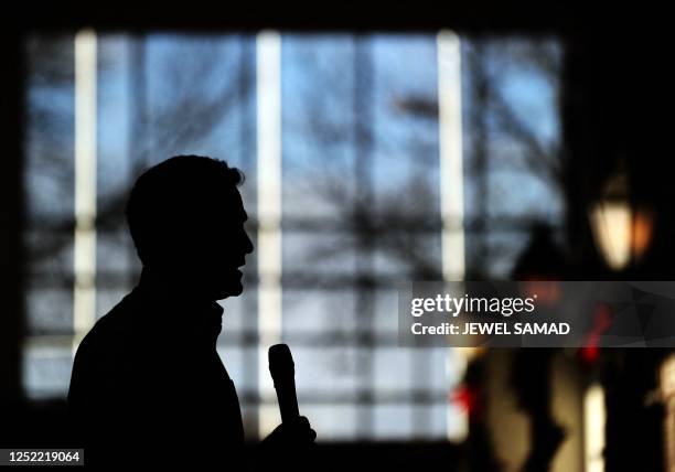 Republican presidential hopeful Mitt Romney speaks during a meeting with voters at the Music Man Square in Mason City, Iowa on December 29, 2011....