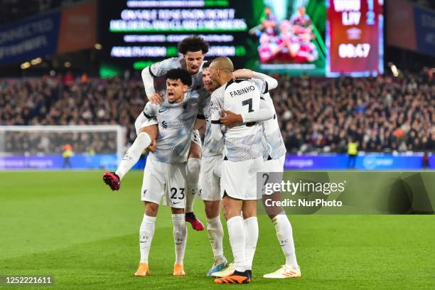 Joel Matip of Liverpool celebrating with his teammates after scoring his team's second goal during the Premier League match between West Ham United...