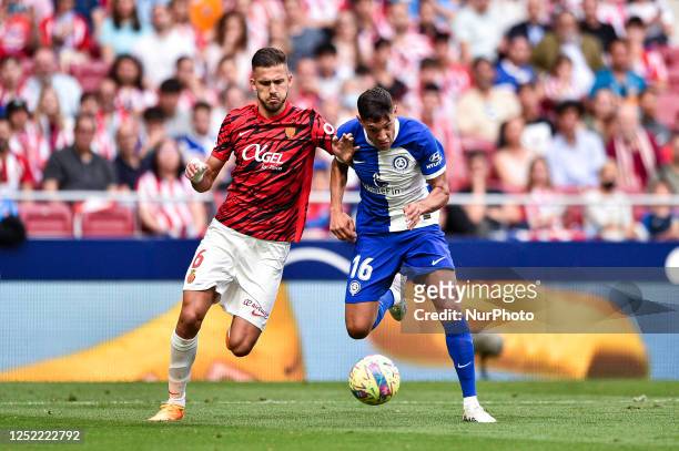 Jose Copete and Nahuel Molina during the La Liga match between Atletico de Madrid and RCD Mallorca at Civitas Metropolitano on April 26, 2023 in...