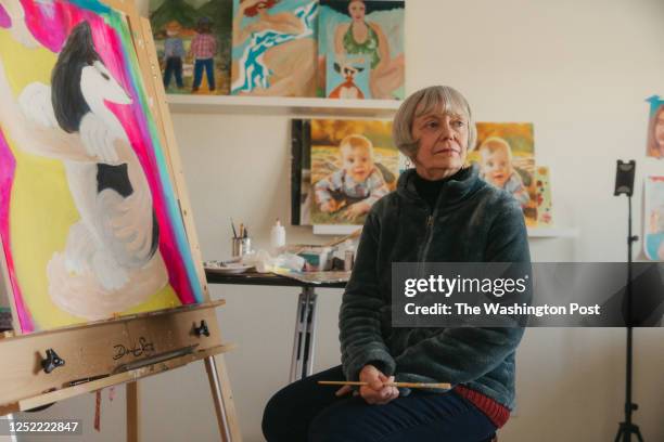 Rebecca Chopp paints in her basement home studio on February 24, 2023. Rebecca was formerly chancellor of the University of Denver when she was...