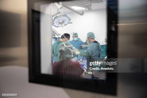 Surgeon tests metaverse application at the operating room as brain tumor surgery is operated by metaverse applications at Ibni Sina Hospital, in...