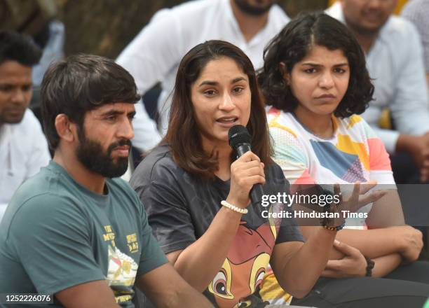 Wrestlers Bajrang Punia, Vinesh Phogat, Sakshi Malik, and others addressing media persons during forth day dharma their protest against the Wrestling...