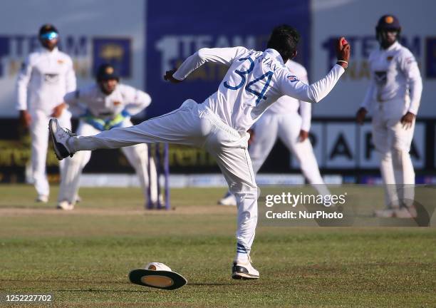 Dushan Hemantha of Sri Lanka throws the ball back during day four of the second Test match between Sri Lanka and Ireland at the Galle International...
