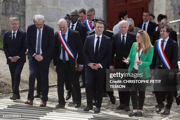 French President Emmanuel Macron and Jean-Marc Ayrault , former French Prime Minister who now serves as the President of the Foundation for the...