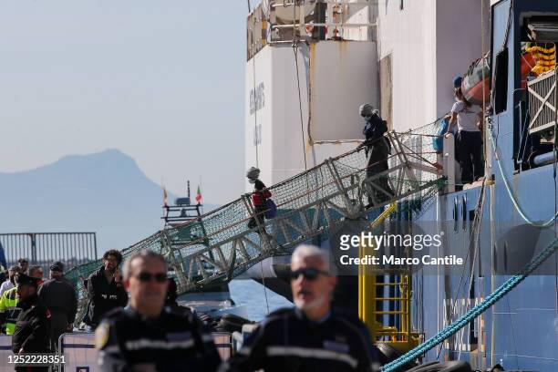 Migrants disembark in Naples, from the Geo Barents rescue ship, after being saved from a shipwreck in the Mediterranean sea.