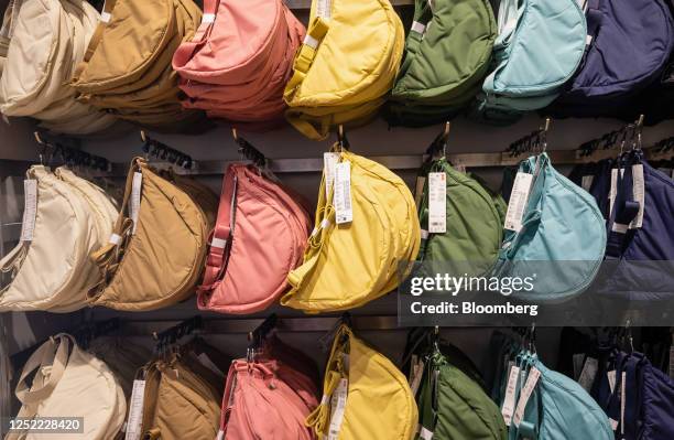 Crossbody bags for sale on the opening day of the new Uniqlo store, operated by Fast Retailing Co., in the Covent Garden district of London, UK, on...