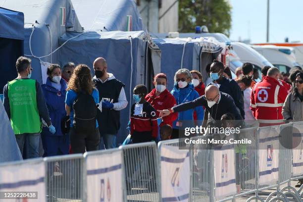 Migrants during the checks after disembarking in Naples, from the Geo Barents rescue ship, after being saved from a shipwreck in the Mediterranean...