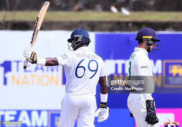 Angelo Mathews of Sri Lanka celebrates after he scored a half-century during day four of the second Test match between Sri Lanka and Ireland at the...