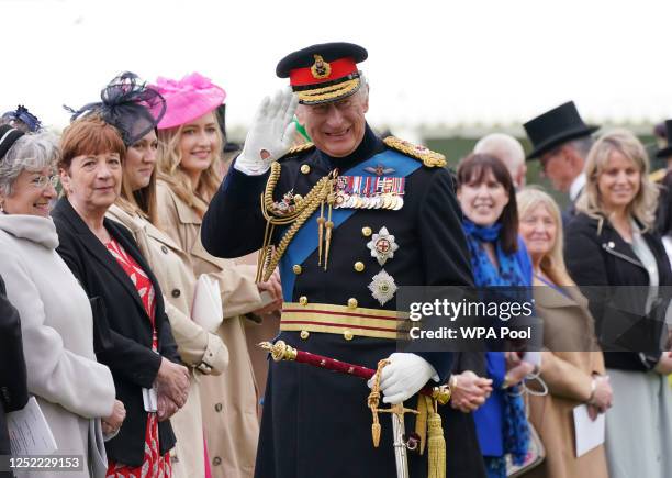 King Charles III is seen meeting guests after a ceremony where he presented new Standards and Colours to the Royal Navy; the Life Guards of the...