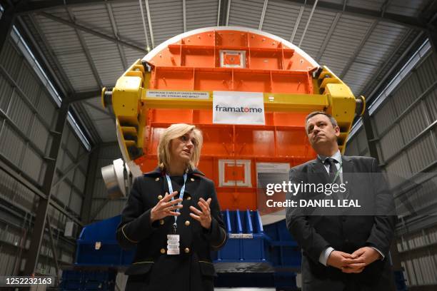 French Minister for Energy Transition, Agnes Pannier-Runacher speaks with Luc Remont, CEO of EDF , in front of a nuclear reactor built by framatome...