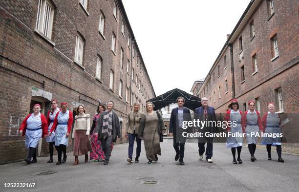 Cast members, Laura Main Rebecca Gethings, Georgie Glen, Jenny Agutter, Annabelle Apsion, Stephen McGann and Cliff Parisi walk with tour guides...