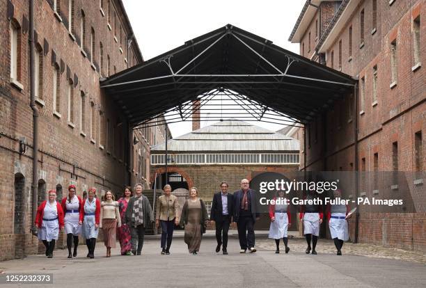 Cast members, Laura Main Rebecca Gethings, Georgie Glen, Jenny Agutter, Annabelle Apsion, Stephen McGann and Cliff Parisi walk with tour guides...