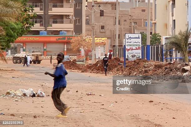 Sudanese army armoured personnel carrier is parked near a trench in Khartoum as fighting continues between Sudan's army and the paramilitary forces,...