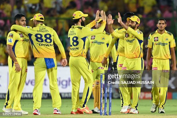 Chennai Super Kings' players celebrate after the dismissal of Rajasthan Royals' Yashasvi Jaiswal during the Indian Premier League Twenty20 cricket...