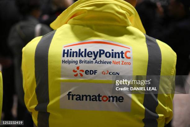 Logos for companies involved in the construction of Hinkley Point C nuclear power station are seen on a high visibility jacket, during a visit to the...