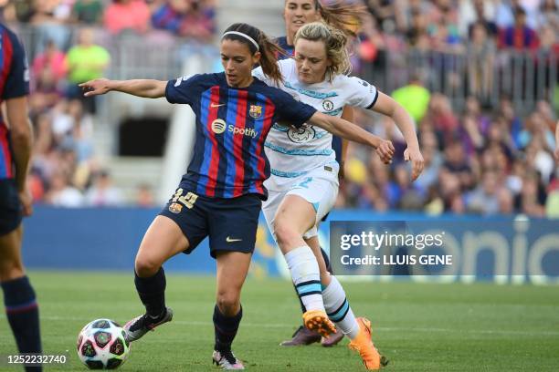 Barcelona's Spanish midfielder Aitana Bonmati fights for the ball with Chelsea's Scottish midfielder Erin Cuthbert during the UEFA Champions League...