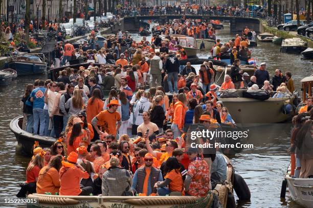 People celebrate King's Day on boats on April 27, 2023 in Amsterdam, Netherlands. April 27 marks the birthday of King Willem Alexander of The...