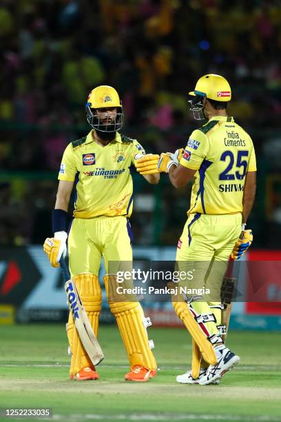 Moeen Ali of Chennai Super Kings and Shivam Dube of Chennai Super Kings interact during the IPL match between Rajasthan Royals and Chennai Super...