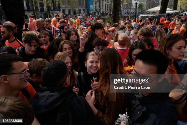 People celebrate King's Day on April 27, 2023 in Amsterdam, Netherlands. April 27 marks the birthday of King Willem Alexander of The Netherlands....