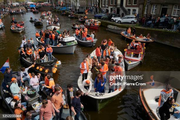 People celebrate King's Day on boats on April 27, 2023 in Amsterdam, Netherlands. April 27 marks the birthday of King Willem Alexander of The...