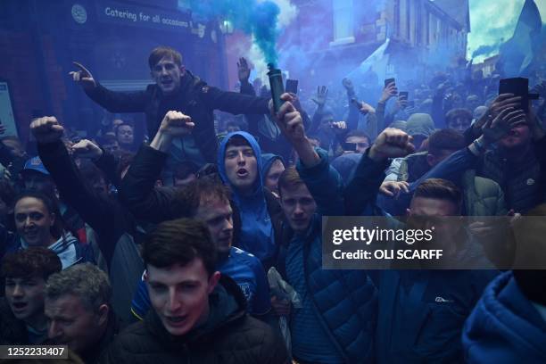 Everton fans let off smoke bombs as they wait for their team bus ahead of the English Premier League football match between Everton and Newcastle...