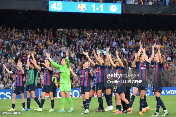 Barcelona's players celebrate after winning the UEFA Champions League semi-final second leg football match between FC Barcelona and Chelsea at the...