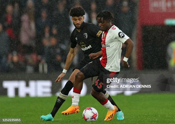 Southampton's Belgian midfielder Romeo Lavia vies with Bournemouth's Danish midfielder Philip Billing during the English Premier League football...