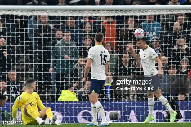 Tottenham Hotspur's Croatian midfielder Ivan Perisic heads the ball off the line during the English Premier League football match between Tottenham...