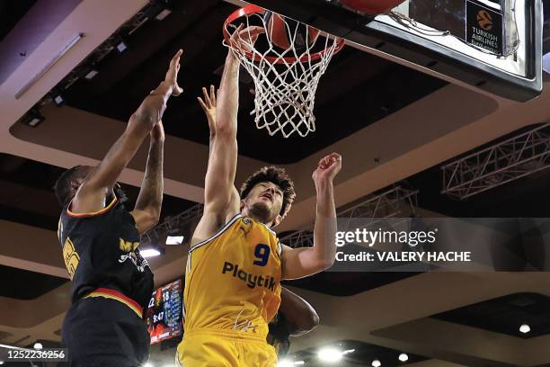 Maccabi' Israeli forward Roman Sorkin fights for the ball with Monaco's US centre Donta Hall during the Euroleague quarter final basketball match...