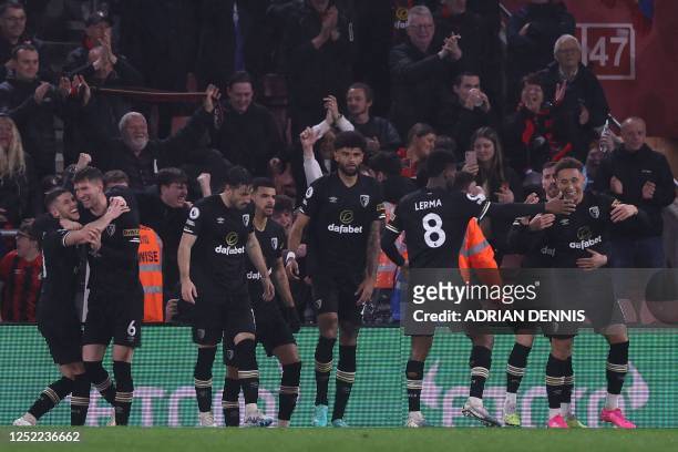 Bournemouth's English midfielder Marcus Tavernier celebrates with teammates after scoring the opening goal of the English Premier League football...
