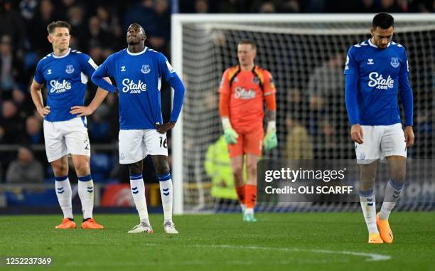 Everton players react after conceding a third goal during the English Premier League football match between Everton and Newcastle United at Goodison...