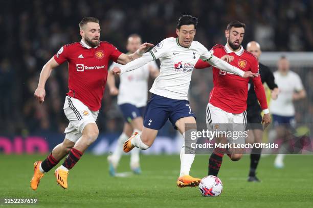 Luke Shaw of Manchester United, Son Heung-Min of Tottenham Hotspur and Bruno Fernandes of Manchester United during the Premier League match between...