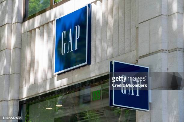 Signage outside a Gap store in San Francisco, California, US, on Thursday, April 27, 2023. Gap Inc. Will eliminate about 1,800 positions as part of a...