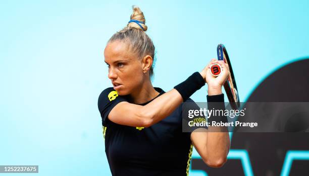 Arantxa Rus of the Netherlands in action against Maria Sakkari of Greece during the second round on Day Four of the Mutua Madrid Open at La Caja...