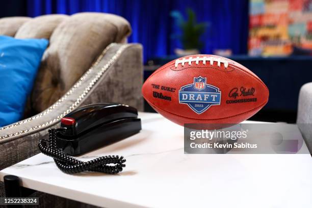 Detail shot of a Wilson football next to a telephone in the green room backstage prior to the first round of the 2023 NFL Draft at Union Station on...