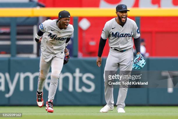 Jazz Chisholm Jr. #2 reacts with Jesus Sanchez of the Miami Marlins at the conclusion of their 5-4 victory over the Atlanta Braves at Truist Park on...