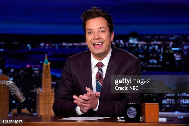 Episode 1841 -- Pictured: Host Jimmy Fallon arrives at his desk on Thursday, April 27, 2023 --