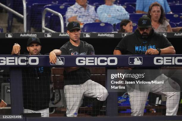 Manager Skip Schumaker of the Miami Marlins, Rod Barajas and bench coach Luis Urueta watch the game against the San Francisco Giants at loanDepot...