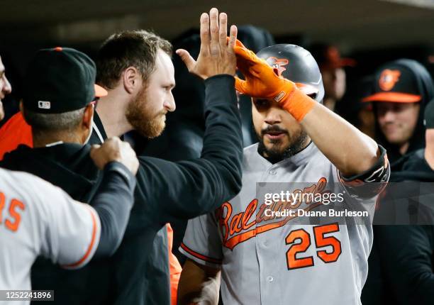 Anthony Santander of the Baltimore Orioles celebrates in the dugout after hitting a two-run home run against the Detroit Tigers during the seventh...