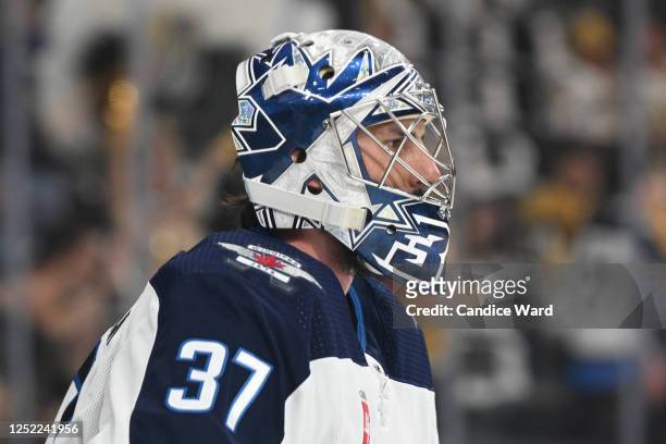 Connor Hellebuyck of the Winnipeg warms up before Game Five of the First Round of the 2023 Stanley Cup Playoffs against the Vegas Golden Knights at...