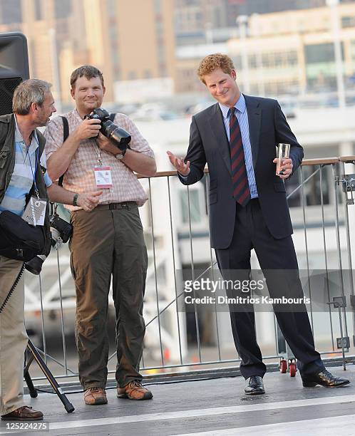Photographer Lucas Jackson and HRH Prince Harry visit the Intrepid Sea-Air-Space Museum on June 25, 2010 in New York City.
