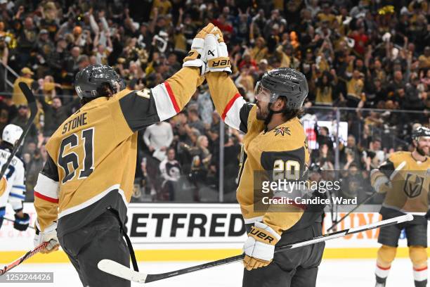 Mark Stone and Chandler Stephenson of the Vegas Golden Knights celebrate Stephenson's second-period goal against the Winnipeg Jets in Game Five of...