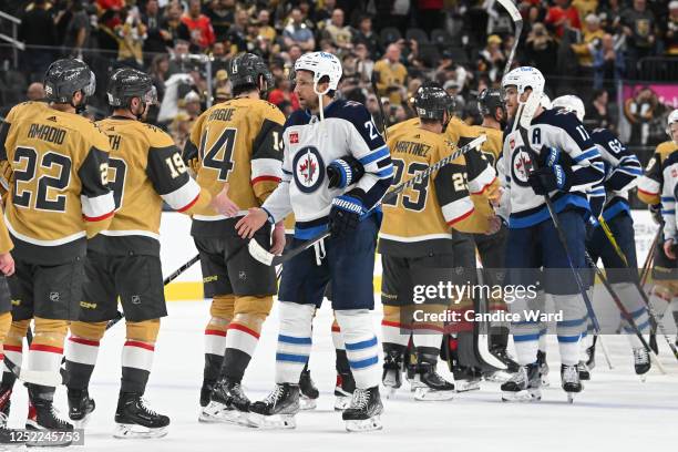 Blake Wheeler of the Winnipeg Jets shakes hands with Vegas Golden Knights players after the Golden Knights' 4-1 victory in Game Five of the First...