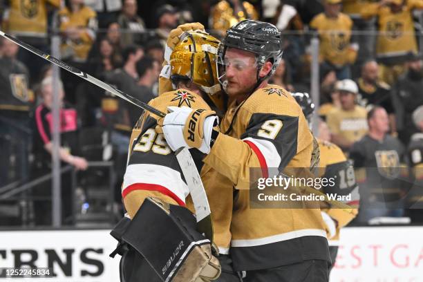 Laurent Brossoit and Jack Eichel of the Vegas Golden Knights celebrate the team's 4-1 victory over the Winnipeg Jets in Game Five of the First Round...
