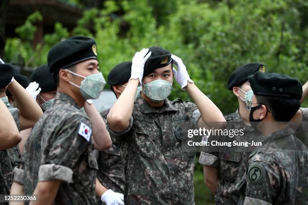 South Korean soldiers attend the ceremony to mark the 70th anniversary of the Korean War in Cheorwon, near the border with North Korea on June 25,...