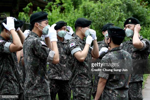 South Korean soldiers attend the ceremony to mark the 70th anniversary of the Korean War in Cheorwon, near the border with North Korea on June 25,...